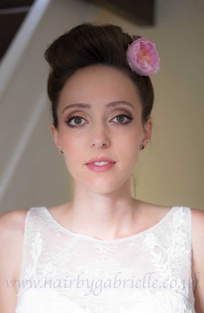 Bride with edgy updo and smoky eye as her bridal look
